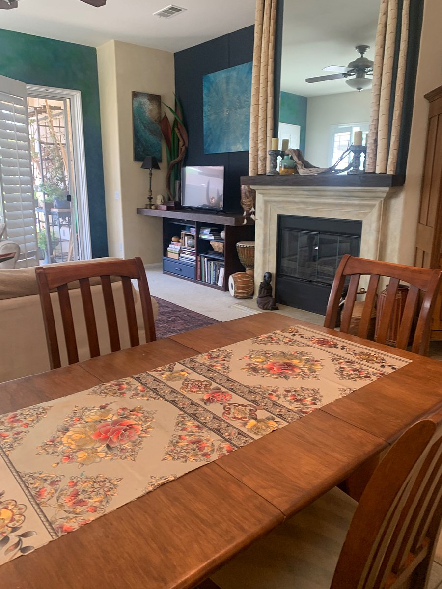 Dining area.
Hand painted fireplace.
Open to the backyard garden.