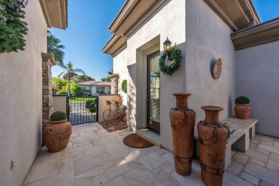 Walkway from street into front courtyard with separate Casita (guest house).