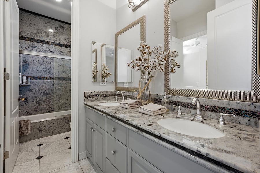 Front Guest Bedroom Bathroom with granite walls and accents.