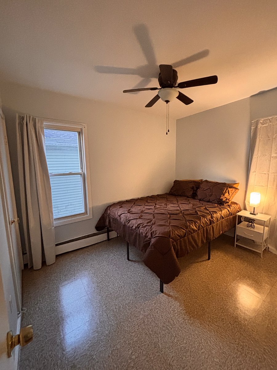 Main level bedroom. Queen sized bed, privy to private office, black out curtains and shared bathroom with only one other tenant. $950