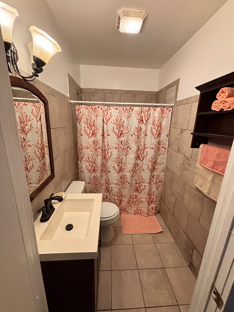 Main level bathroom shared by 2 tenants