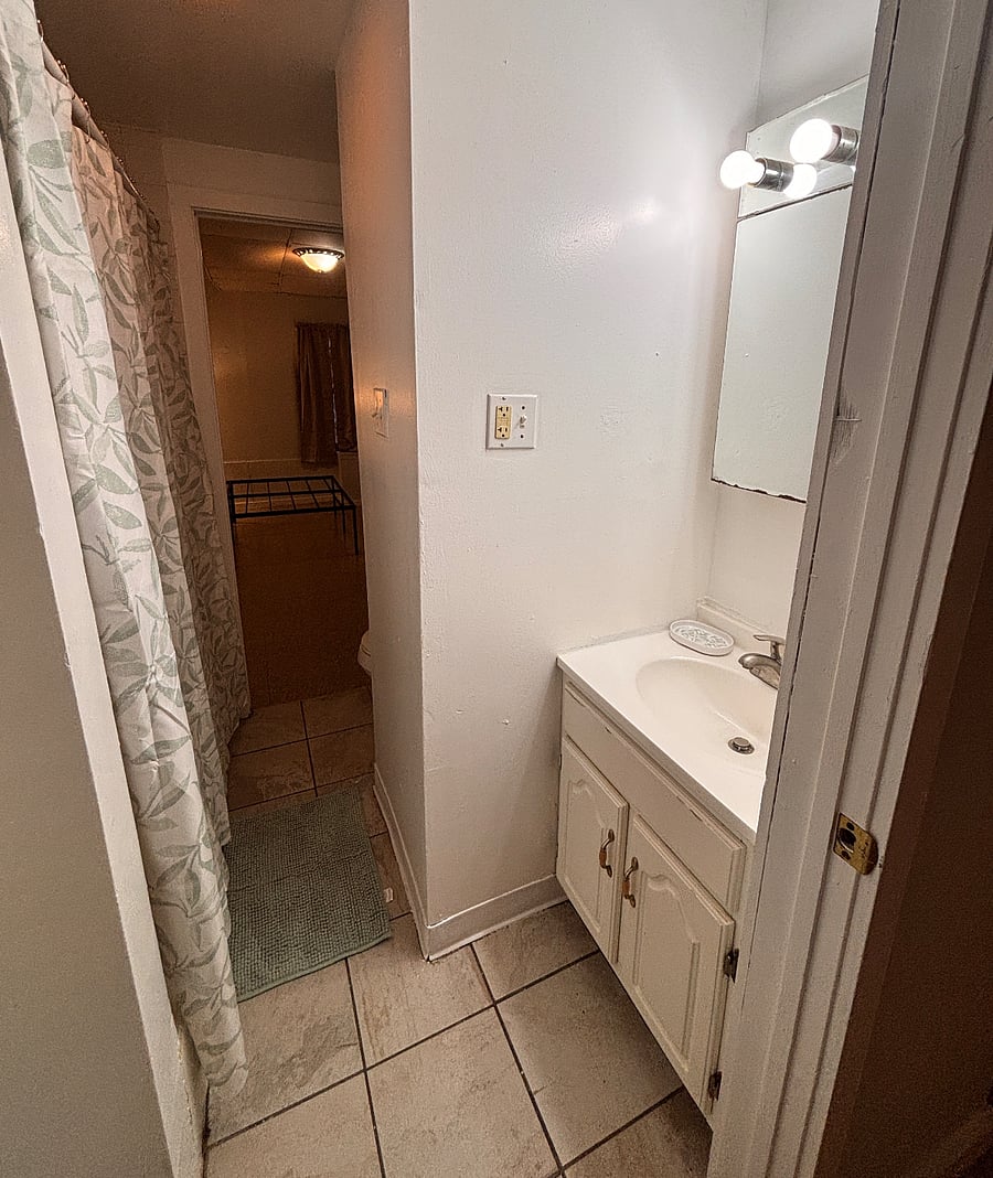 Upper level bathroom to be shared by two rooms. Attached and locked on each side. 