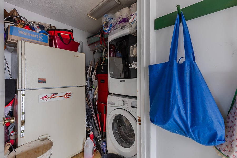 HE washer and dryer in utility room next to the kitchen. Also have a second refrigerator and freezer. 