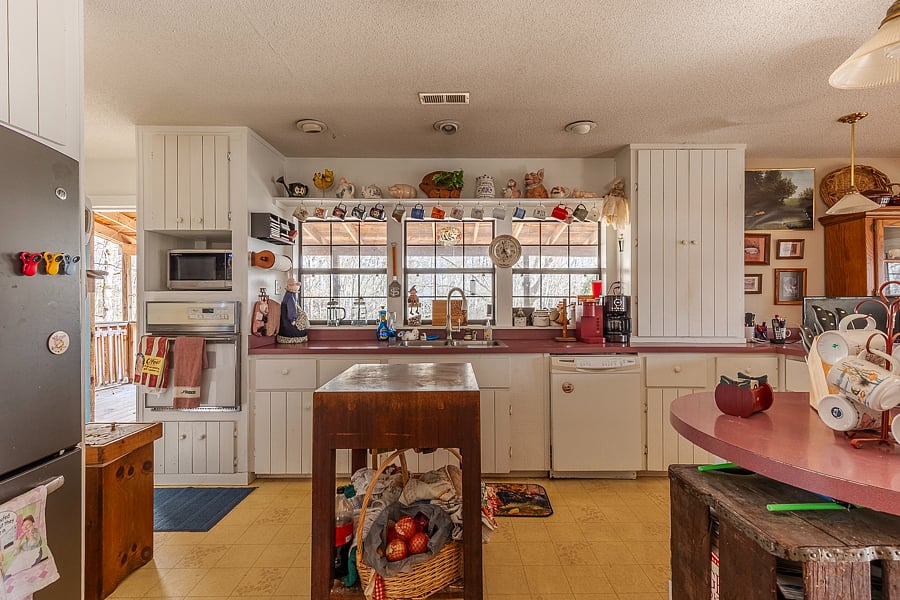 Kitchen is equipped with a dishwasher and French-door refrigerator and freezer. 