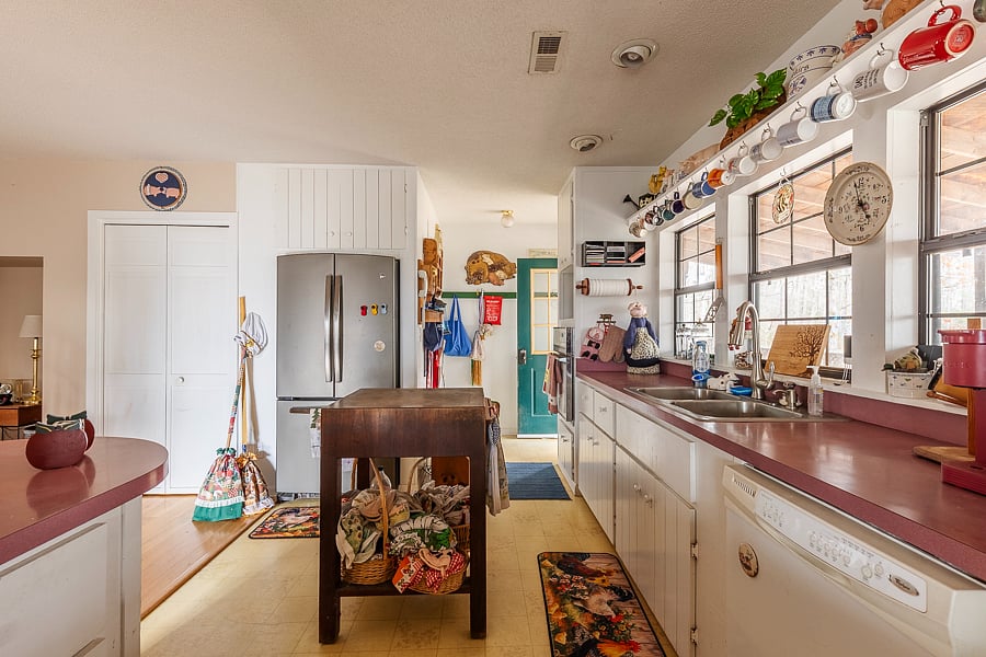 Central to the kitchen is a wonderful chopping block. Also pots, pans, bowls and all the cooking and serving utensils. 