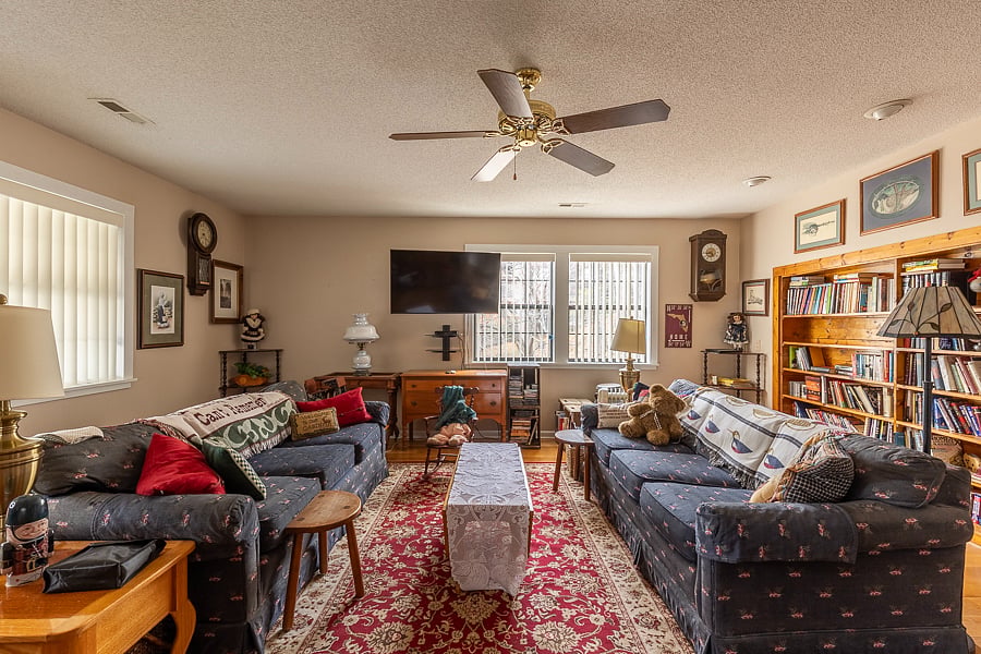 Comfortable living room with large book collection for your after work pleasure. 