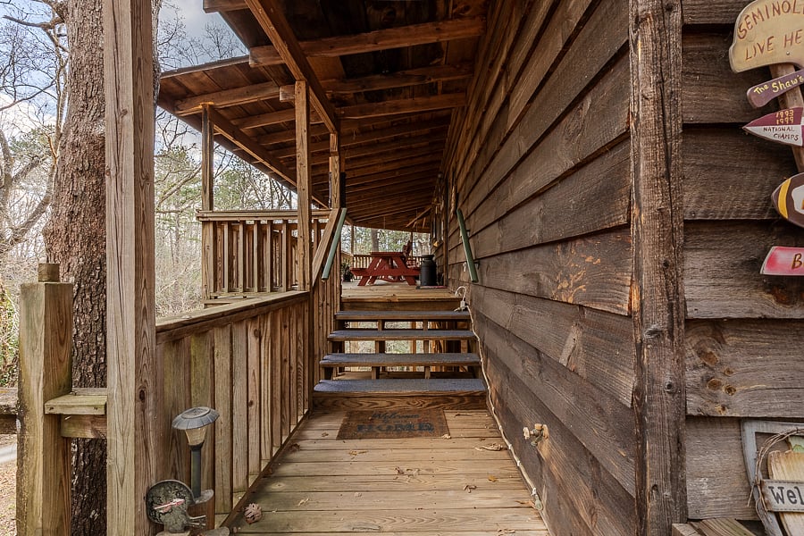 Easy 4 steps to the front porch with handrails. 