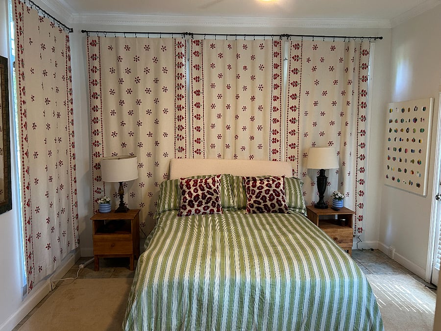 Your Bedroom! There are also 2 closets with hanging and shelf storage and one with your fridge/microwave and Keurig. Doors located to the sides of the bathroom hall.