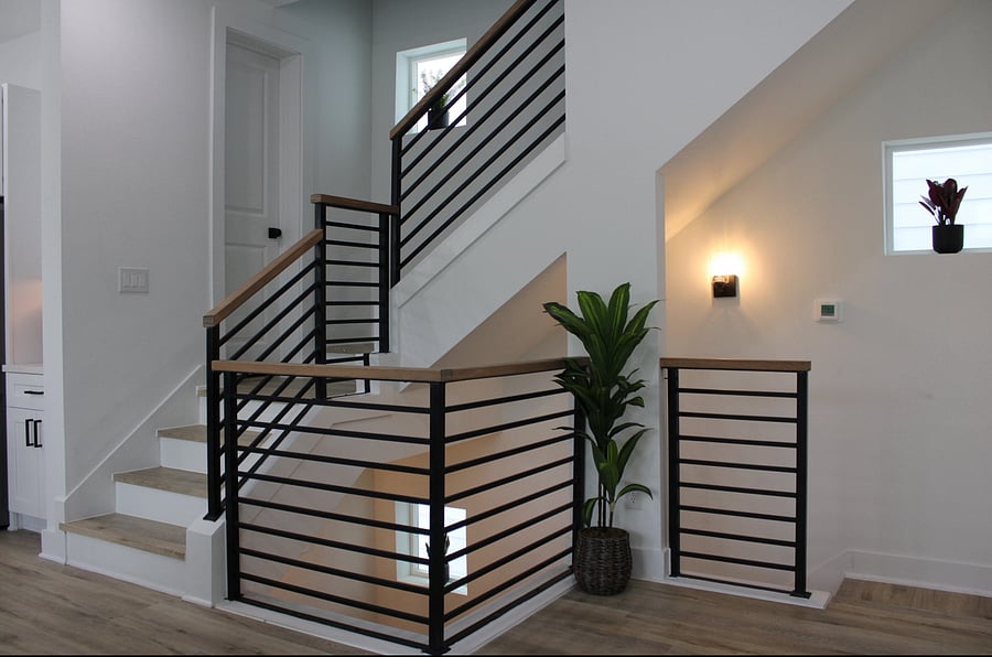 Stairs from second floor to third floor with half bathroom in between