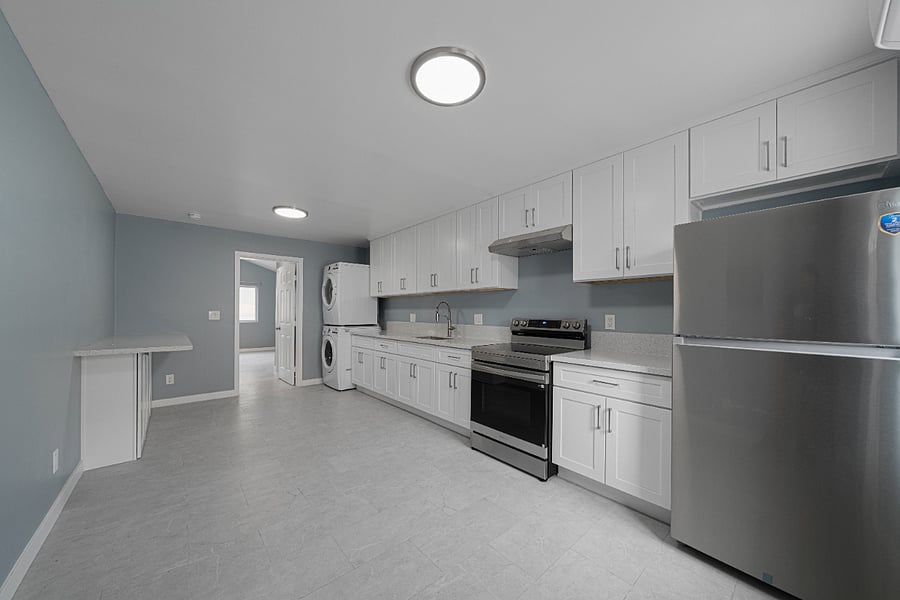 Unit # A
Kitchen with full-sized in-unit washer/dryer for your convenience