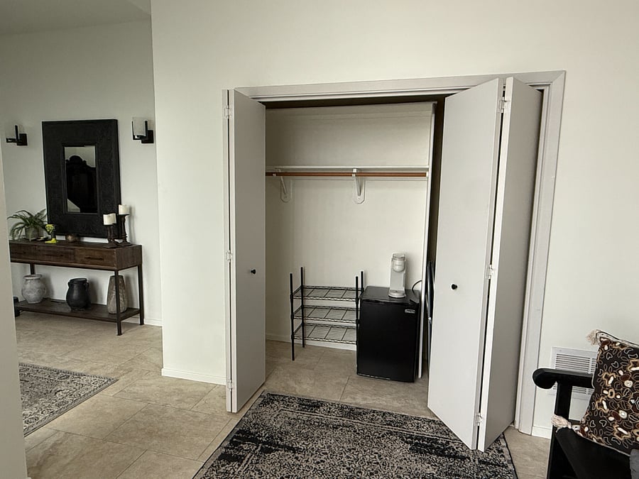 Added Closet Space with mini fridge, Keurig and two shelves of storage.
