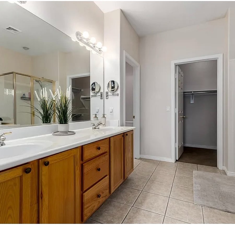 Master bedroom and closet with seperat bathroom space.
