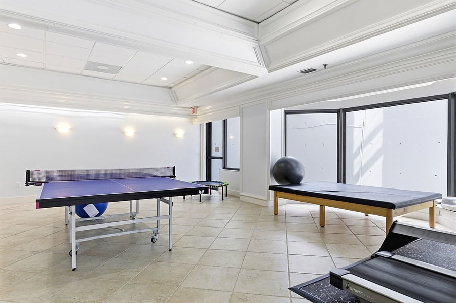 Lounge room with ping pong and pool table. 