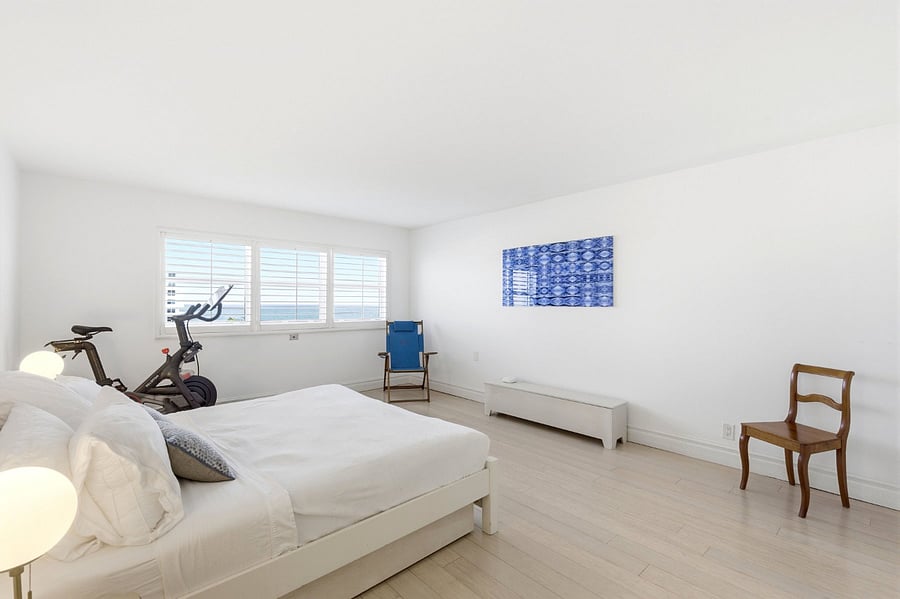 Master bedroom with en suite bathroom and large built out closet. King sized bed. 