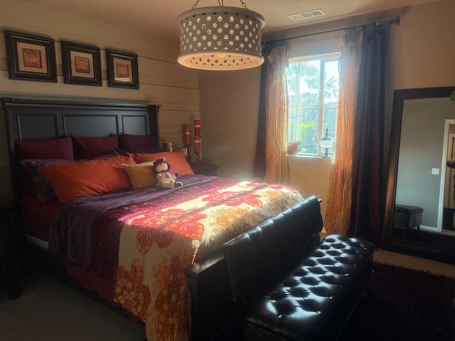 Bedroom w/memory foam queen bed, complete bedding, dresser, nightstands, TV, full-coverage drapes, free-standing mirror, and closet with over-the-door hooks