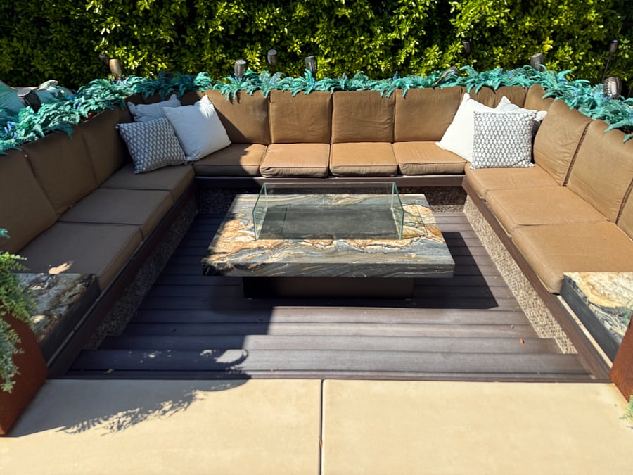 Sunken outdoor lounge area with fire-table