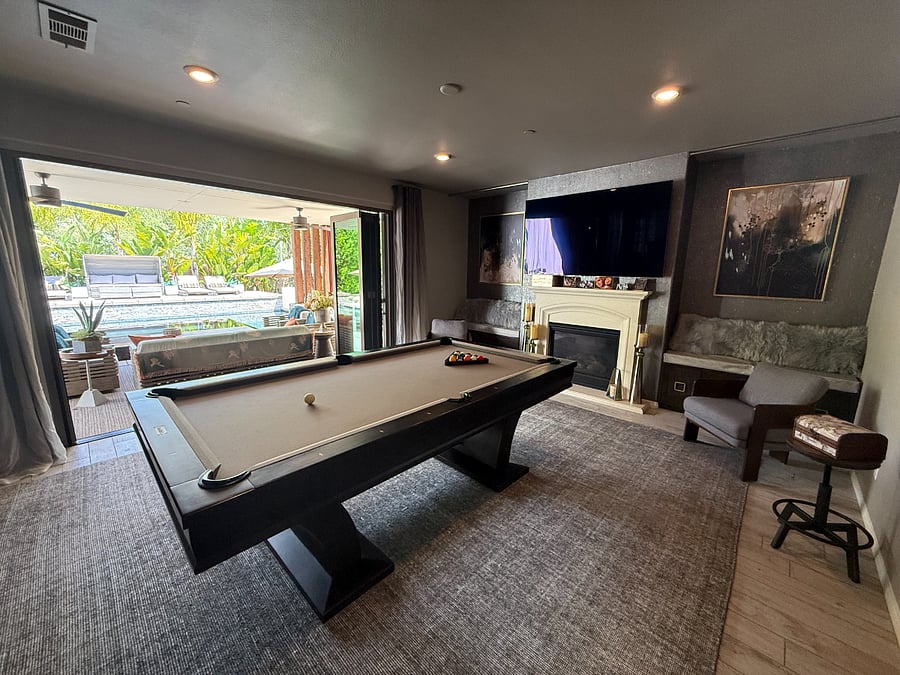 Family room with large screen TV, and pool table
