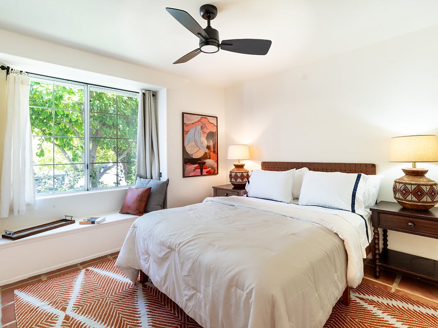 Front bedroom with garden view and reading nook 