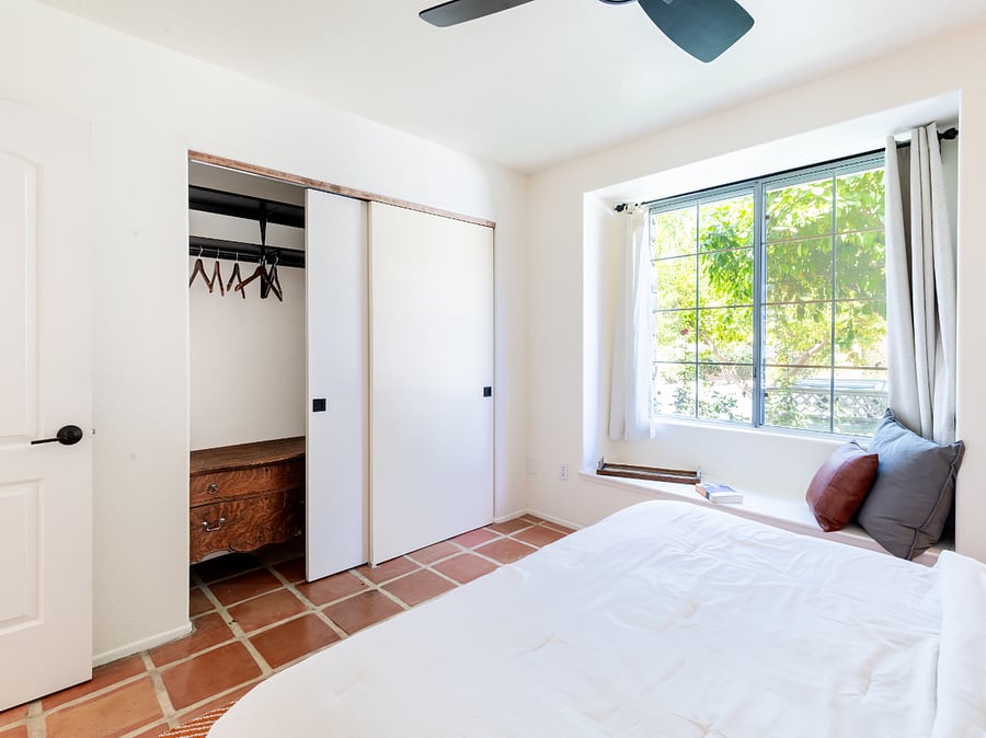 Large closets with storage and hampers.