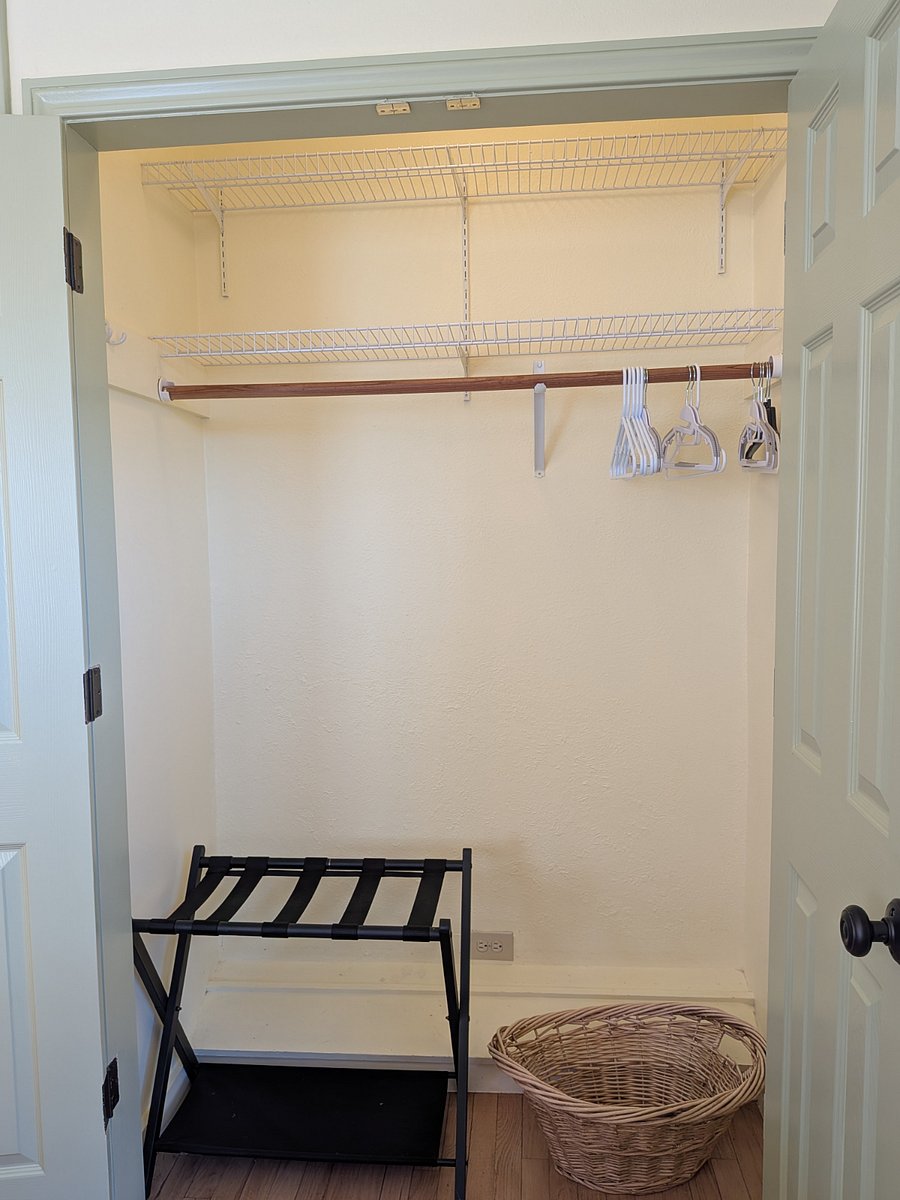 This is the main Closet with folding doors, shoe rack, 2 shelves and a laundry basket.