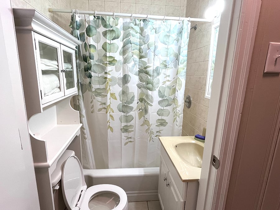 Bathroom
with toileteries, towel and initial toilett paper, stand up washer dryer