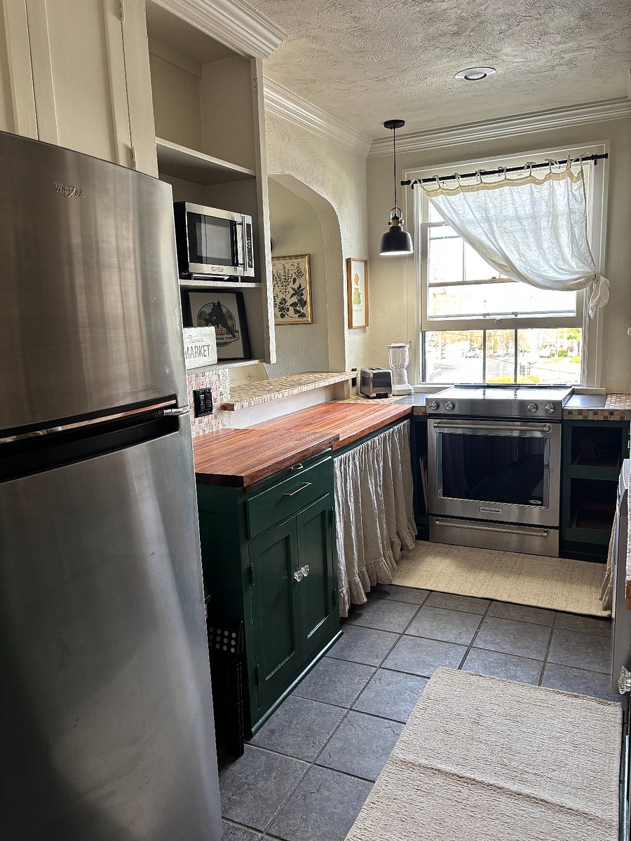 Full kitchen with oven/stove, full refrigerator, coffee maker, blender, microwave, dishwasher, plates, utensils, pots & pans