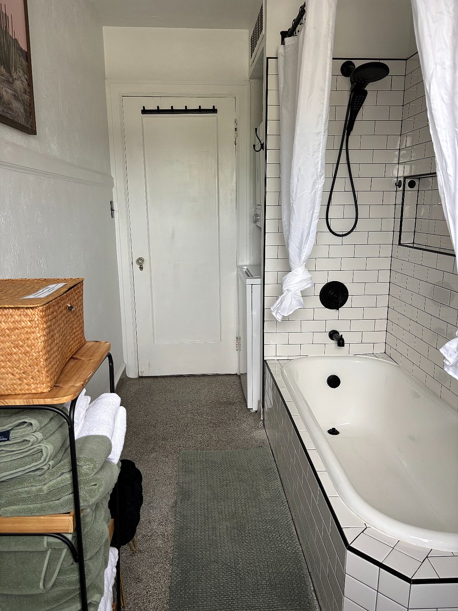 Newly renovated bathroom with bathtub / shower and in-unit washer & dryer