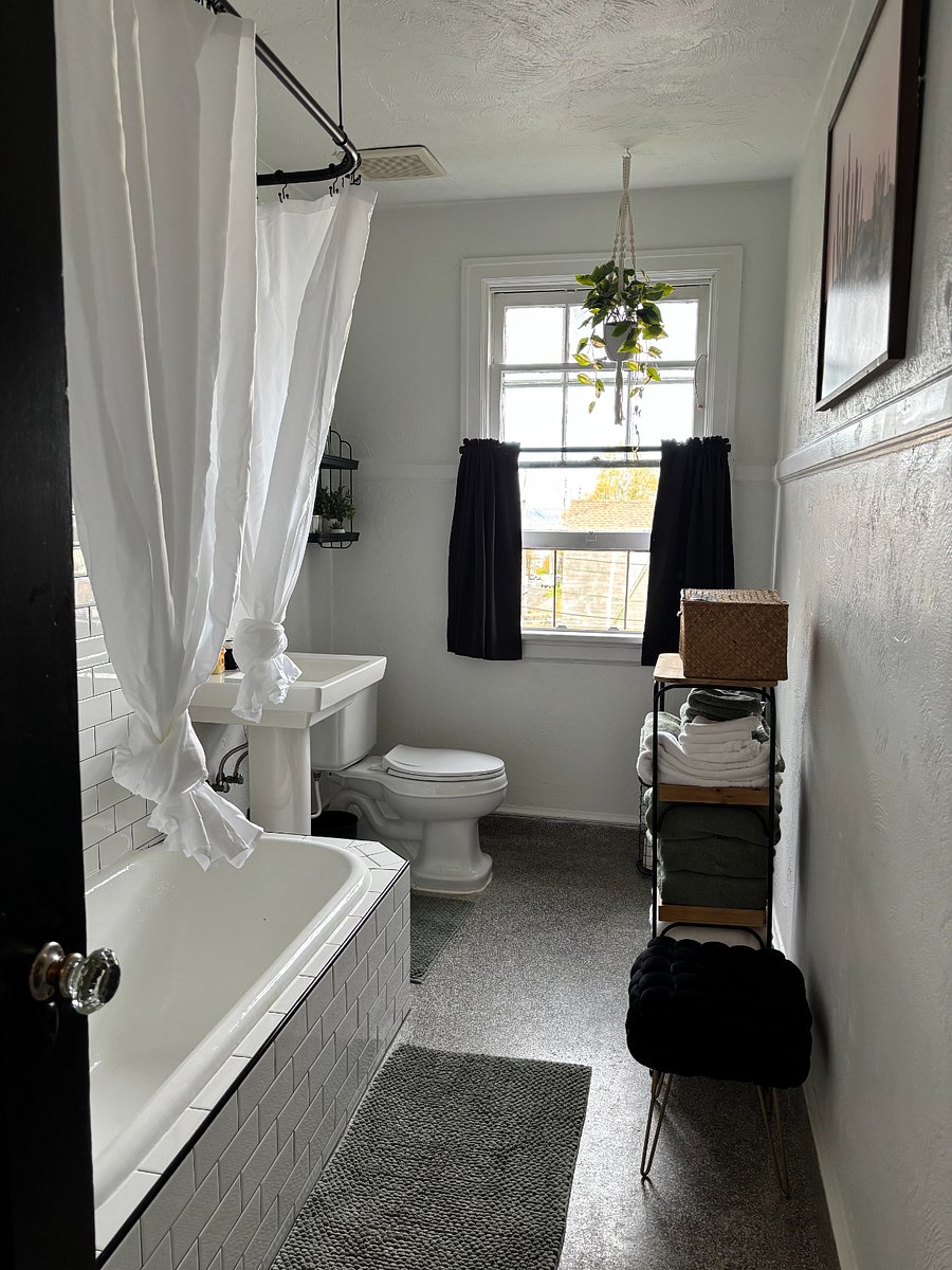 Newly renovated bathroom with bathtub / shower and in-unit washer & dryer
