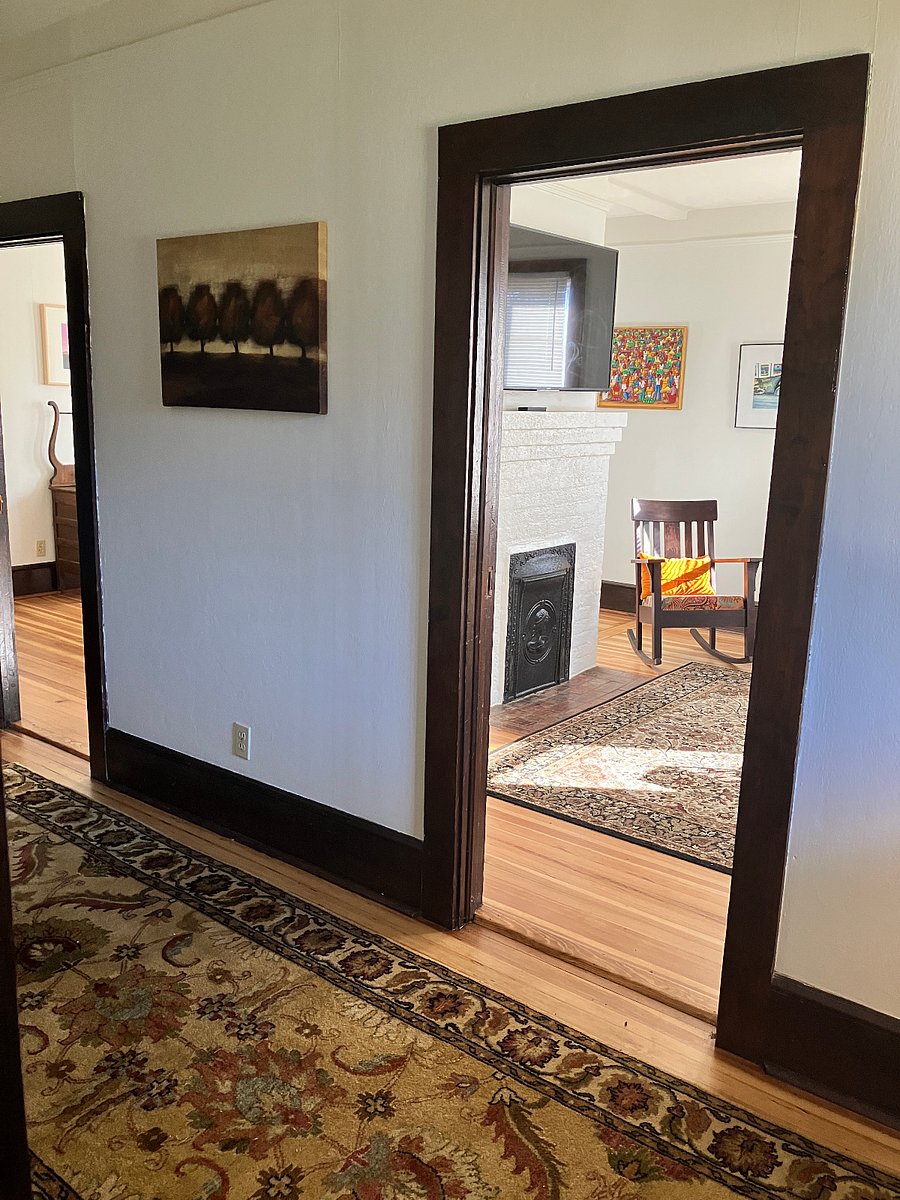 Looking from the front (second) bedroom into the wide hallway.