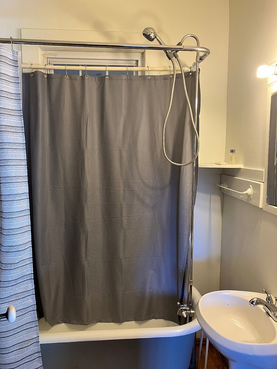 The claw-foot tub has a shower arm too.