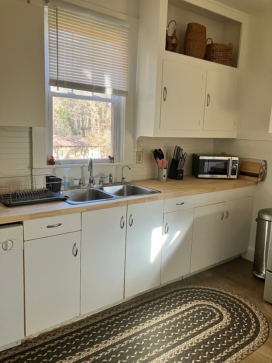 Dishwasher, double sink, microwave. The dishwasher is old but works well. 
