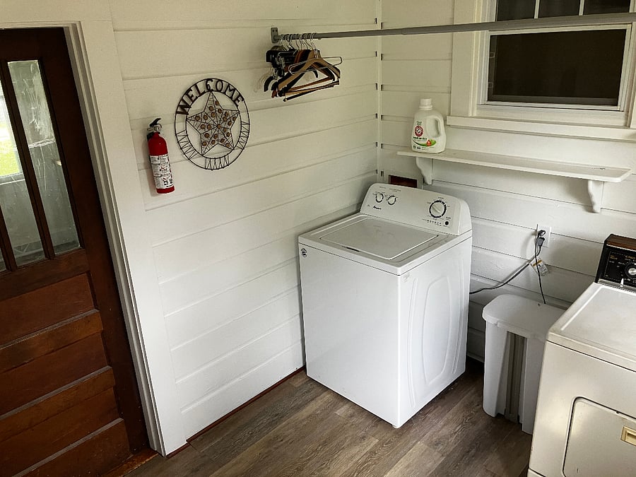 The door on the left leads into the kitchen. There's an electronic lock on that door. 