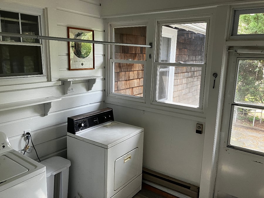 Laundry room/mudroom. The washer and dryer are old but they work great! The door on the right leads to the back patio.