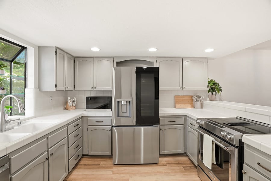 Open kitchen overlooks dining and living space