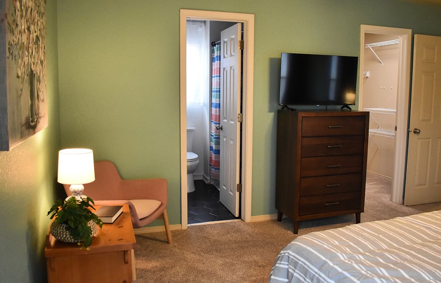 Primary Bedroom with view of ensuite and walk-in closet