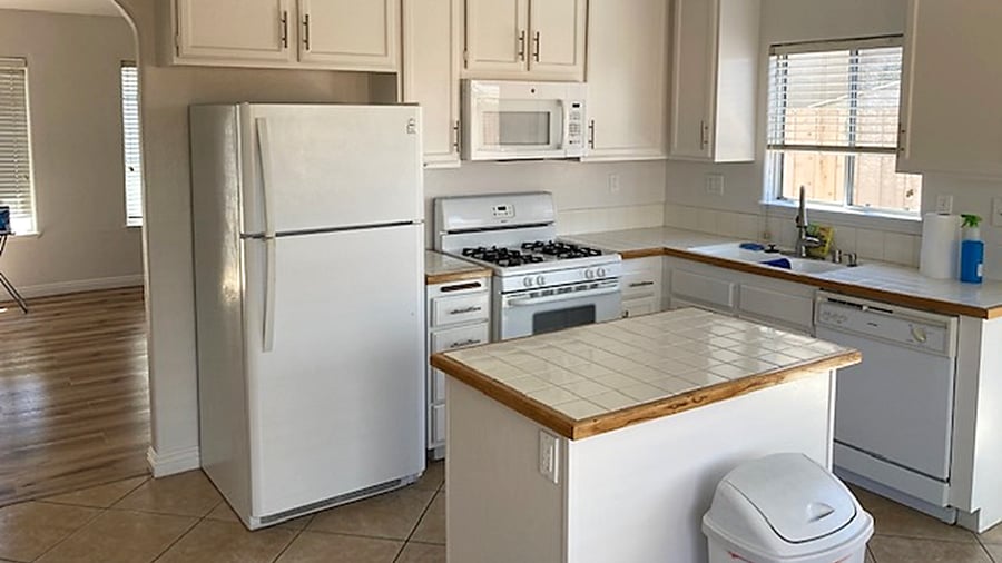Refridgerator, stove, dishwasher, and microwaver oven with island.