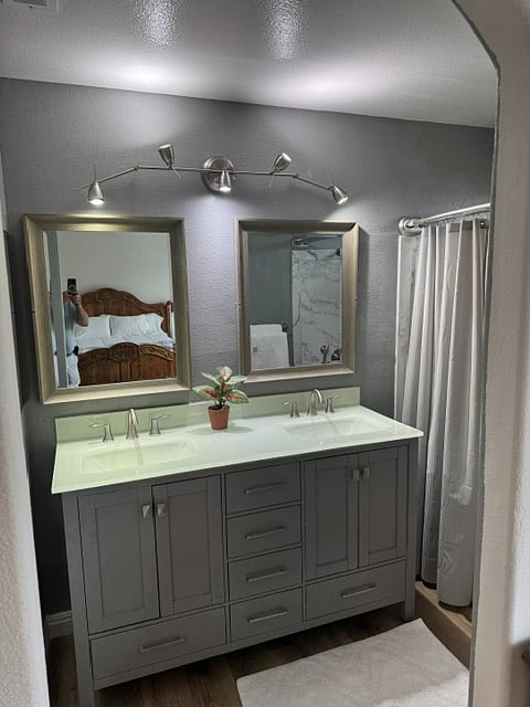 Master Bedroom - unique glass 2-bowl sinks  part of the glass countertop