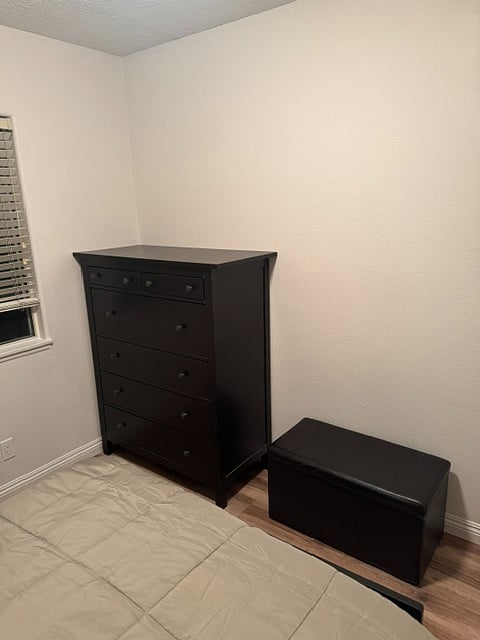 Middle Bedroom - with chest of drawers and black leather hope chest / bench seat