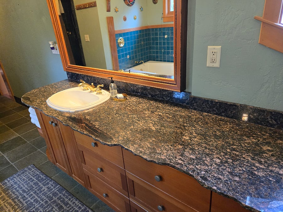 Artisan granite counter with tons of room and live edge.