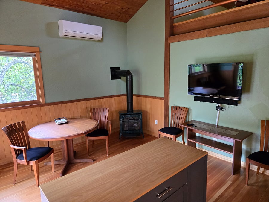 Eat in kitchen with table that expands for up to six. Gas stove gives cozy heat and ambiance off a thermostat, so no work.