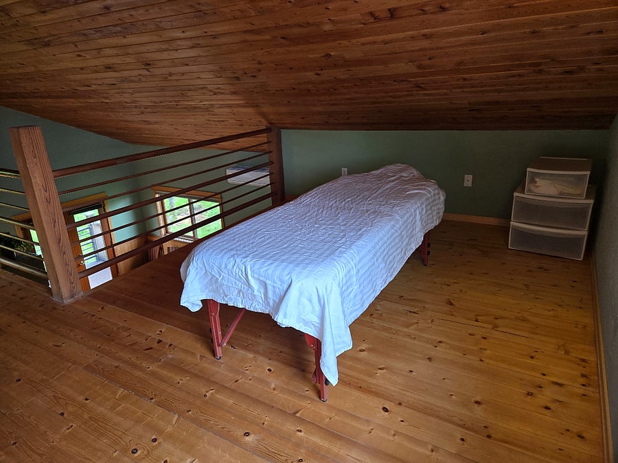 Set up now with a massage table, but can also have the crib here if needed.