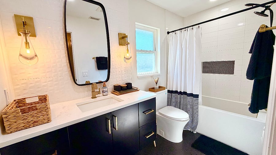 Modern bathroom with walk-in shower and updated finishes.