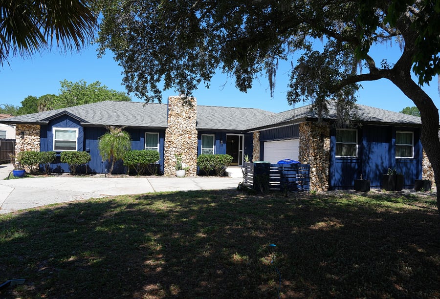 Front of home with tons of parking.