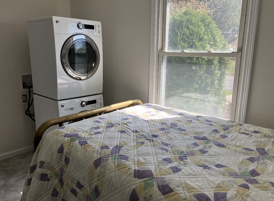 Downstairs bedroom 1 with stackable washer and dryer