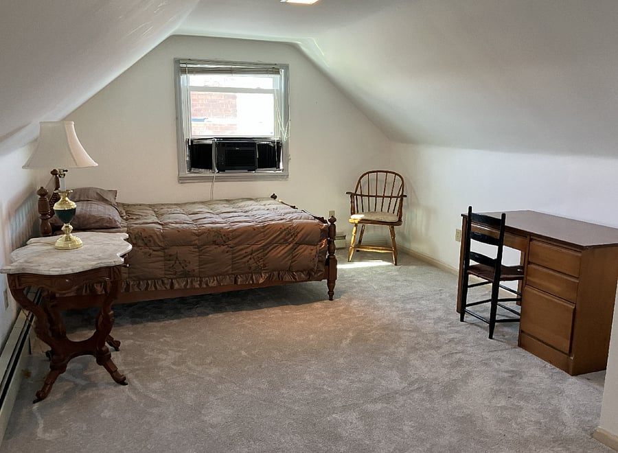 Upstairs bedroom 3 with queen bed, desk, table and lamp