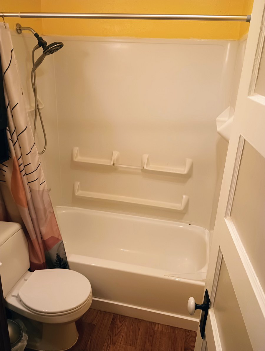 Main bathroom tub and shower.