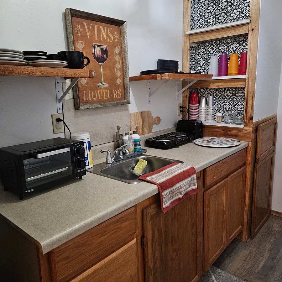 Kitchen. Toaster over and two burner elec stovetop. 