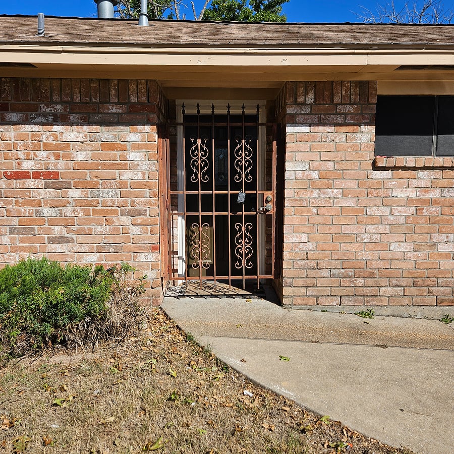 Outdoor entry into house, and the guest studio is just inside this door. There is a keypad code on the door.