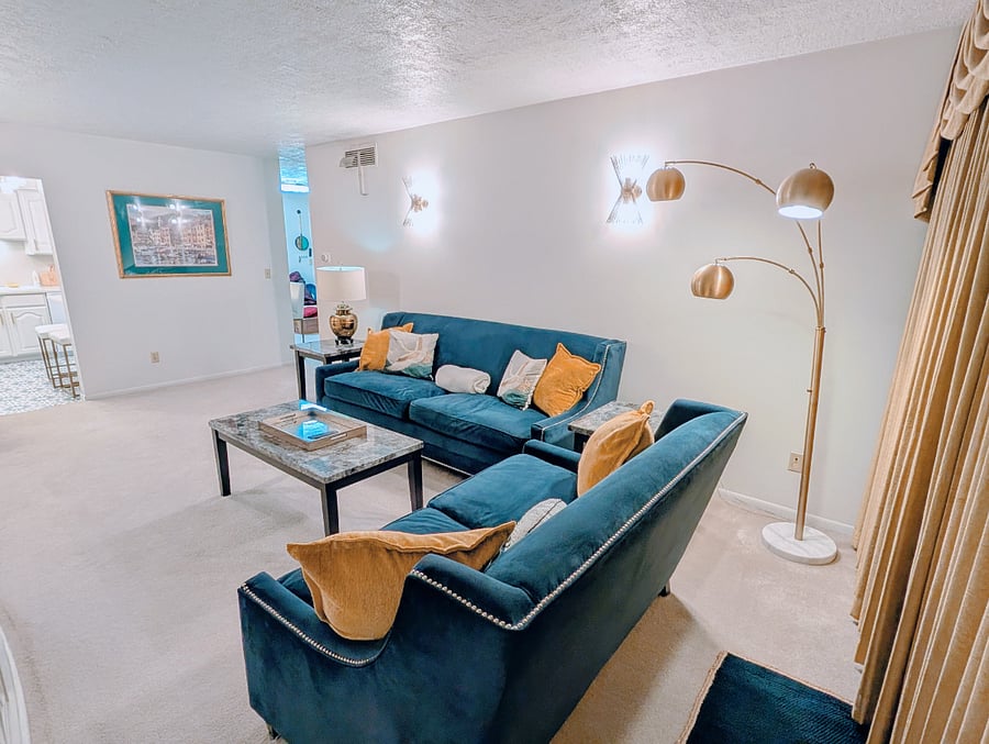 Large living room with electric fireplace and TV