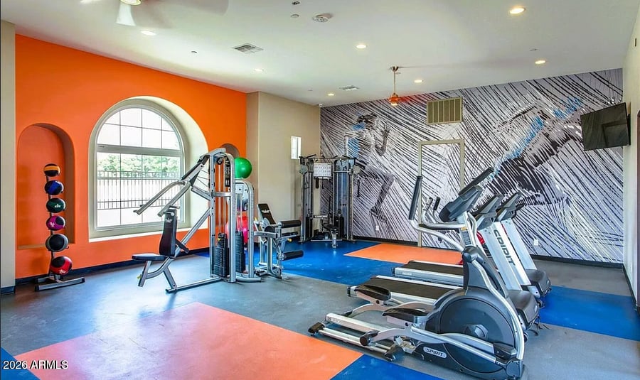 On-site fitness center with cardio and strength equipment.